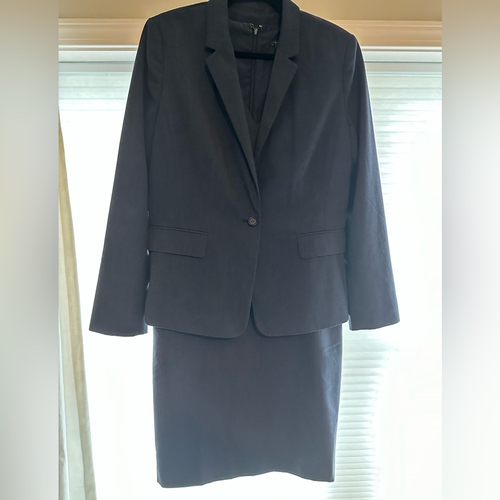 Three piece blue Ann Taylor suit including dress, skirt; and jacket. Size 14.